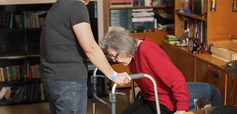 How to help an elderly person up from a chair safely