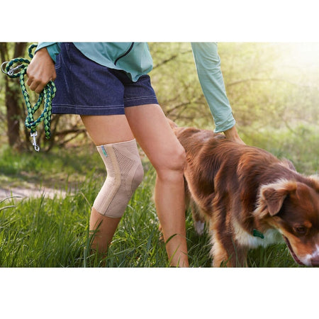 Packaging or retail box for Actimove Knee Support with Two Stays support with branding and size information.