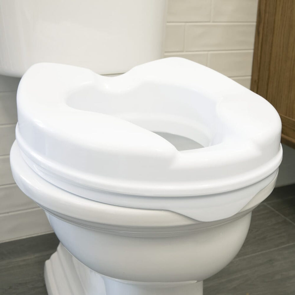 Image of Ashby Easyfit Raised Toilet Seat on a plain background.