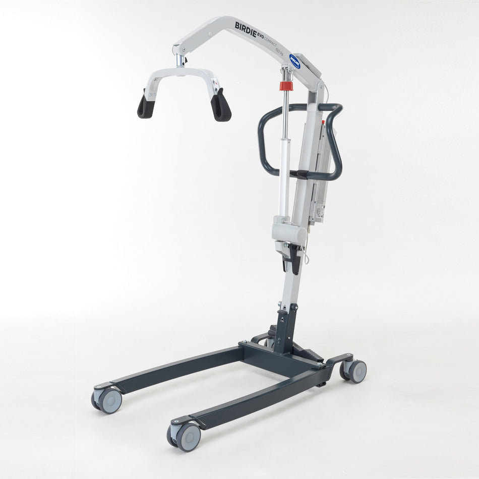 Birdie Folding Electric Hoist hoist being used to lift a person, demonstrating safe patient transfer.