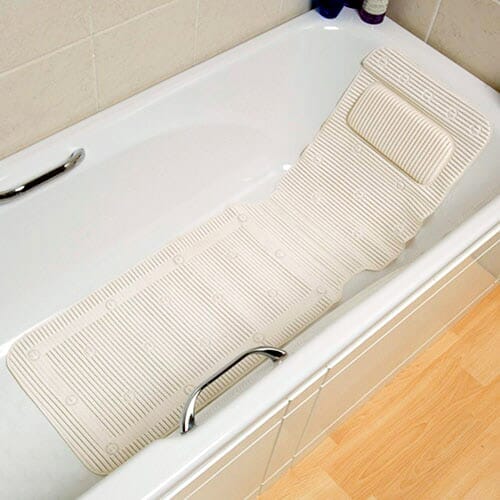 Cushioned Bath Mat With Integral Pillow cushion on a seat or chair, demonstrating added comfort and pressure relief.