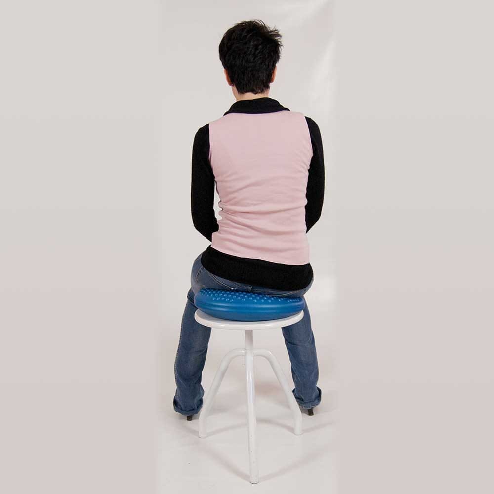 DiscoSit Balance Air Cushion cushion being compressed by a hand to show the level of support.