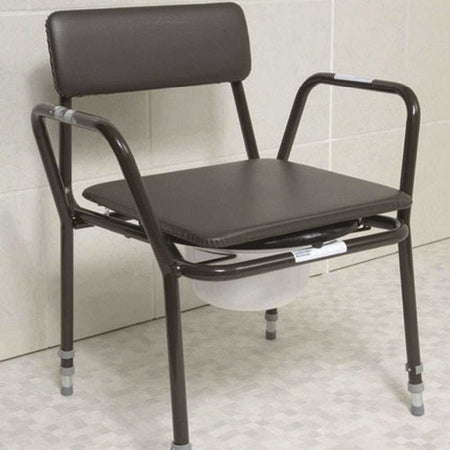 Dovedale Extra Low Commode with lid closed, highlighting the padded seat and discreet design.