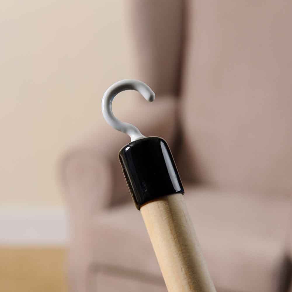 Lifestyle image of Dressing Stick Deluxe being used in a real-life setting.