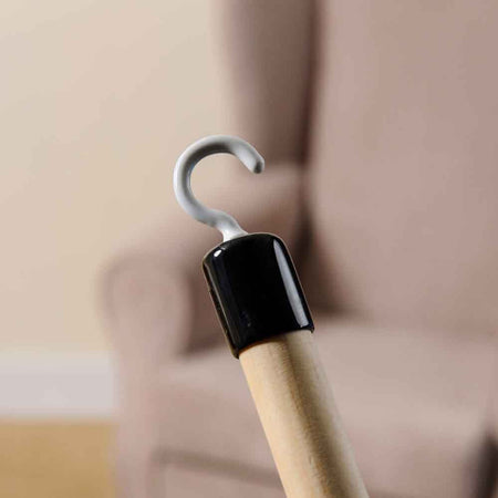 Lifestyle image of Dressing Stick Deluxe being used in a real-life setting.