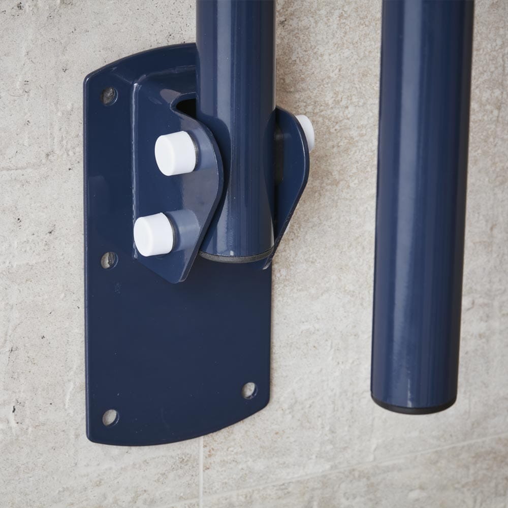 Lifestyle image of Economy Folding Toilet Support Rail-Blue being used in a real-life setting.