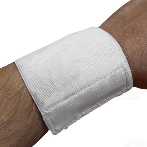 Economy Wrist Support support laid flat on a plain background, showing its breathable, elasticated material.