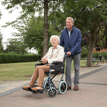 Lifestyle image of Escape Lite Manual Wheelchair being used in a real-life setting.