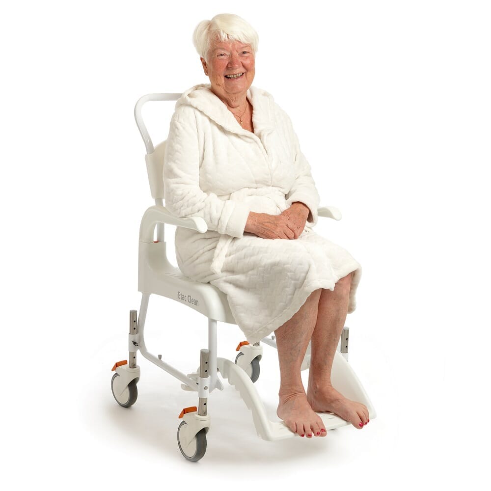 Close-up of Etac Clean Shower Commode Chair seat ring and supportive arms, showing comfort and stability.