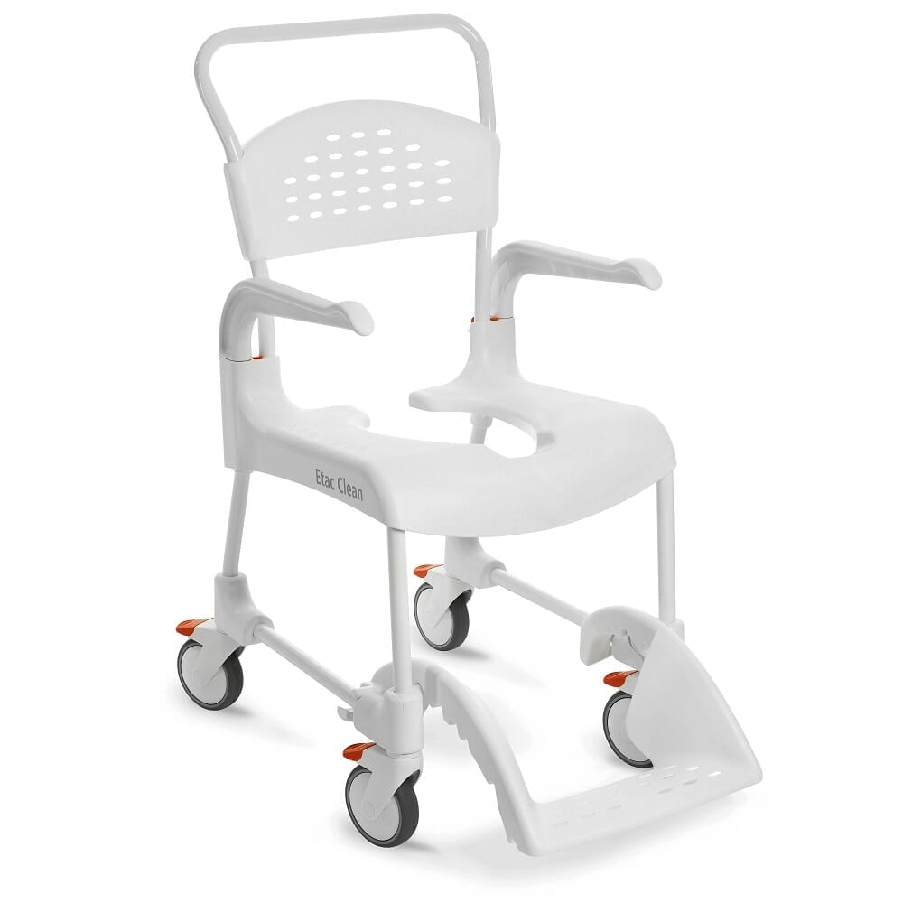 Etac Clean Shower Commode Chair with lid raised showing the open seat and removable commode pan, with supportive arms and adjustable height on a plain background.