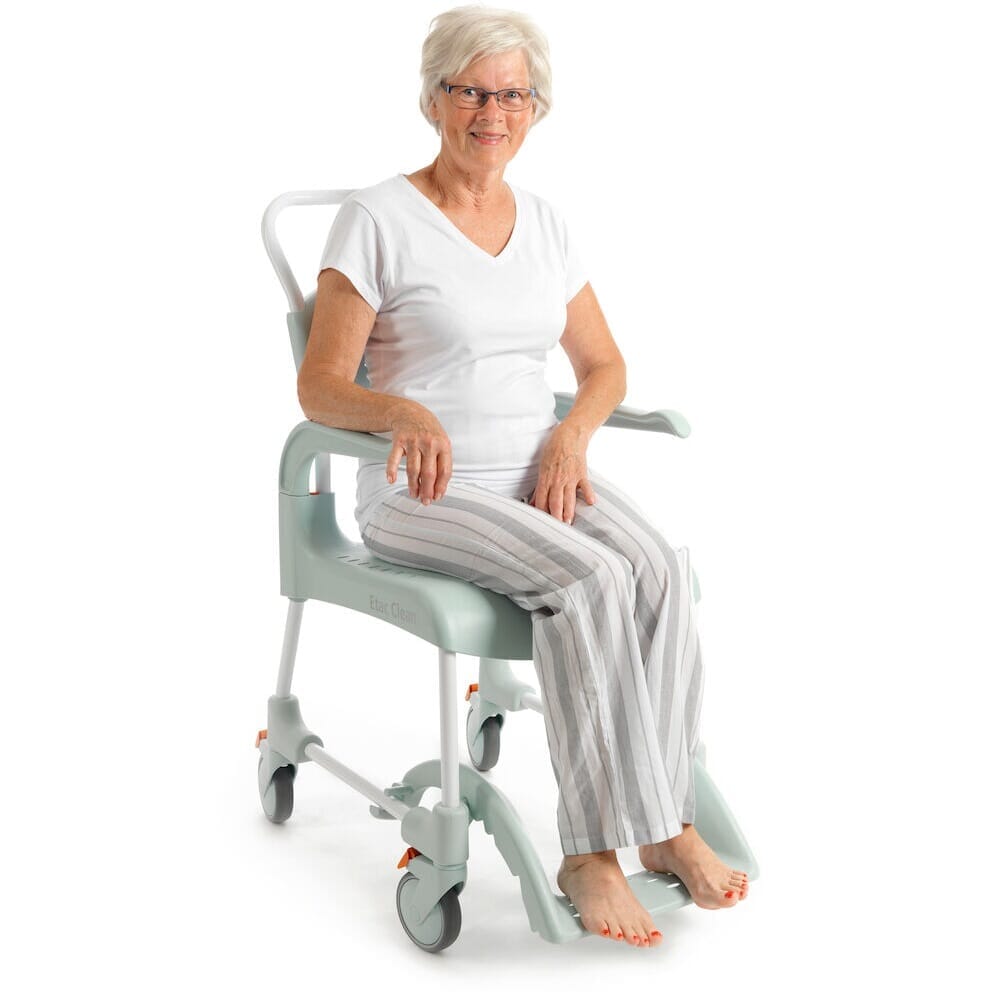 Etac Clean Shower Commode Duo Pack positioned in a home environment such as a bedroom or bathroom, demonstrating its discreet appearance.