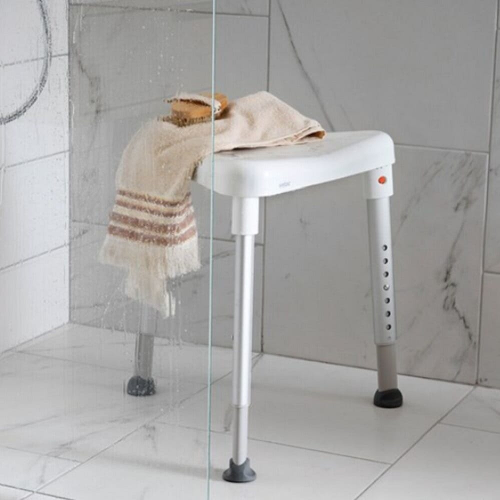 Top view of Etac Edge Shower Stool showing drainage holes in the seat for quick water runoff.
