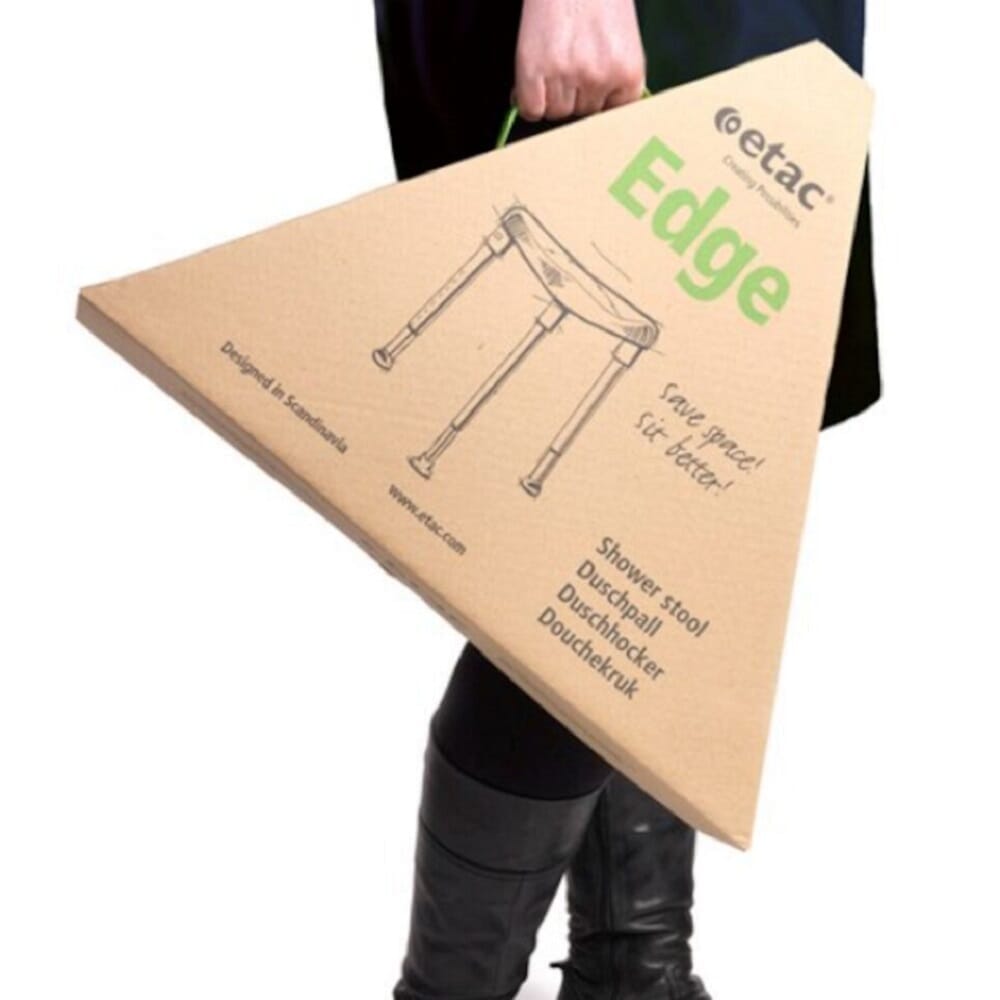 Close-up of a leg on Etac Edge Shower Stool shower stool, showing the height adjustment holes and rubber ferrule.