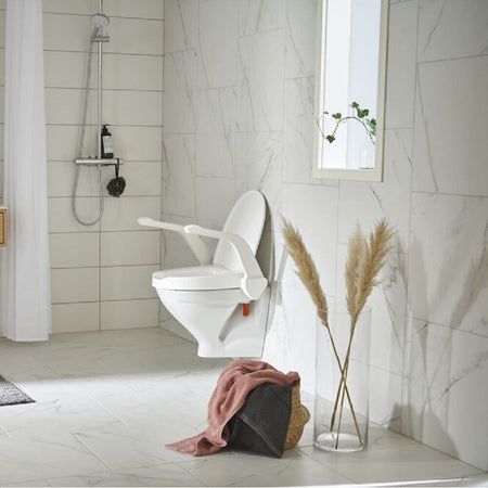 Image of Etac My-Loo Fixed Toilet Seat with Arm Rests on a plain background.