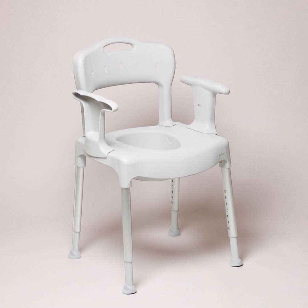 Etac Swift Commode with lid closed, highlighting the padded seat and discreet design.