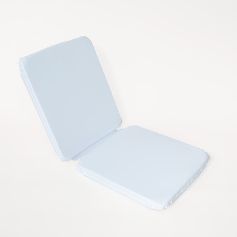 Foam Padded Bath Cushion cushion being compressed by a hand to show the level of support.