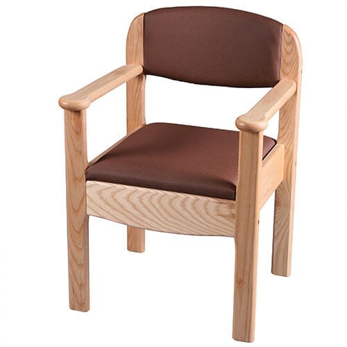 Gordon Ellis Royale Commode with lid raised showing the open seat and removable commode pan, with supportive arms and adjustable height on a plain background.