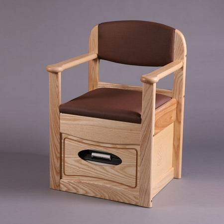 Gordon Ellis Royale Flushing Commode with lid closed, highlighting the padded seat and discreet design.