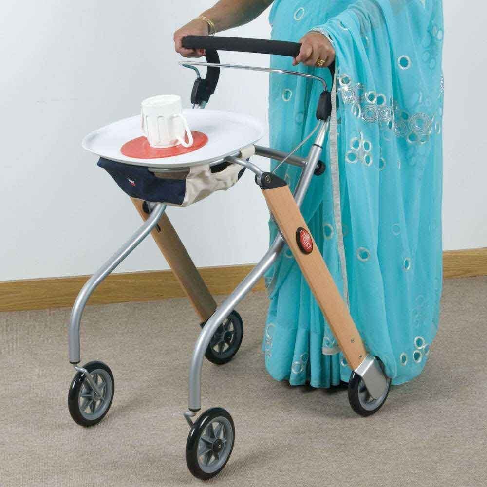 Front view of Lets Go Indoor Rollator rollator with seat and padded backrest, showing the handlebars and brake cables.