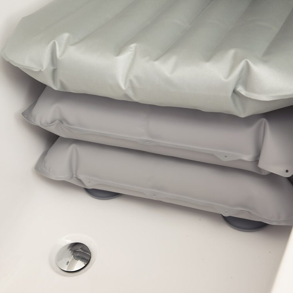 Mangar Bathing Cushion cushion being compressed by a hand to show the level of support.