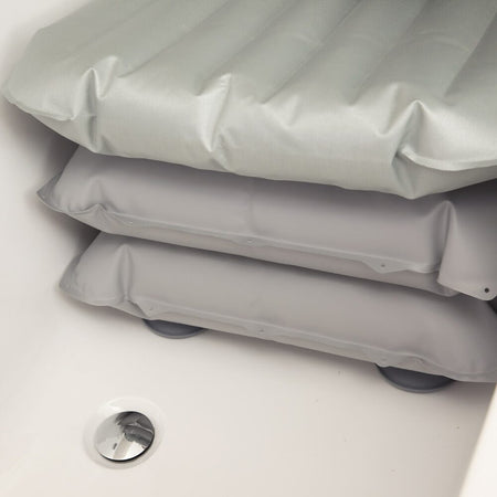 Mangar Bathing Cushion cushion being compressed by a hand to show the level of support.