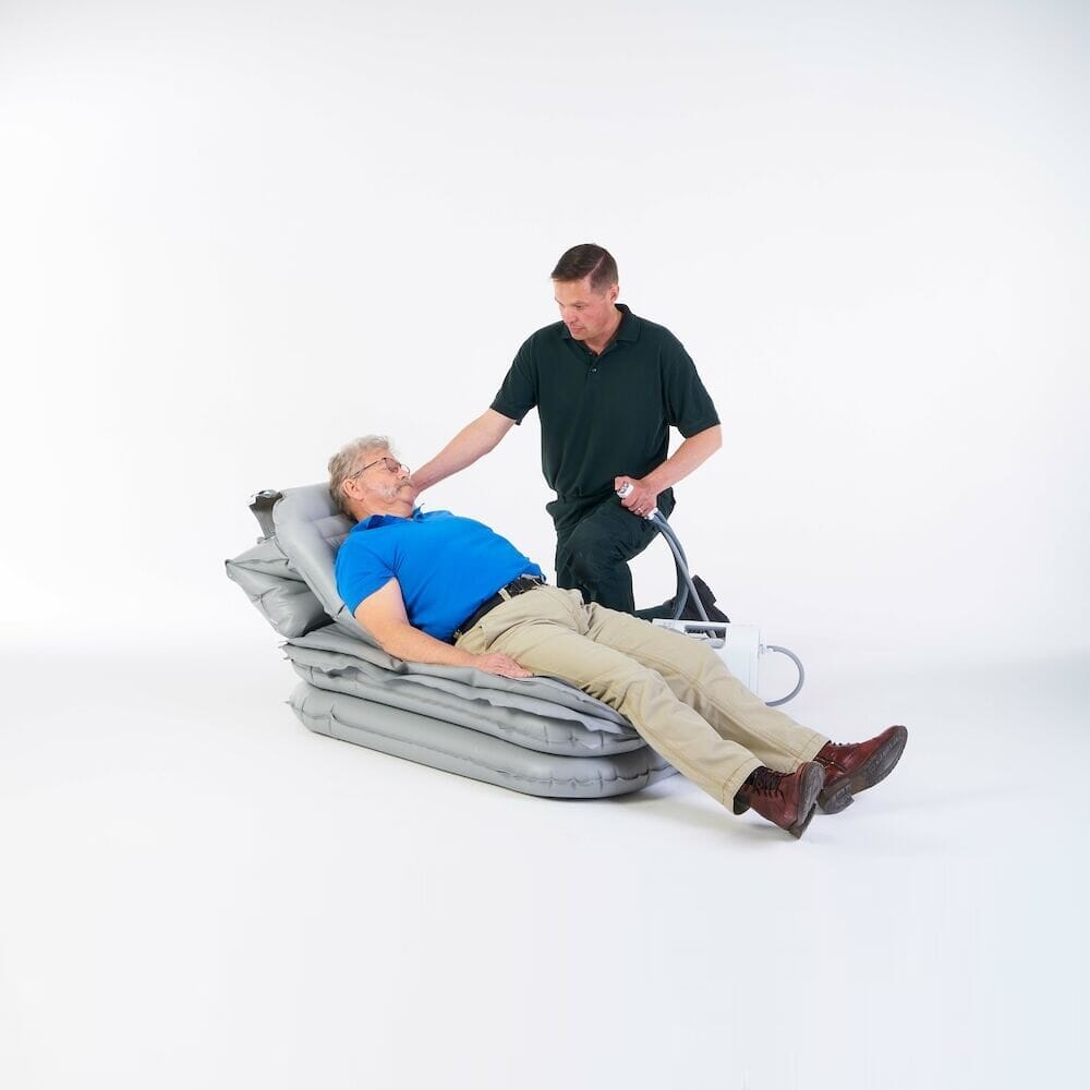 Mangar Eagle Lifting Cushion cushion being compressed by a hand to show the level of support.