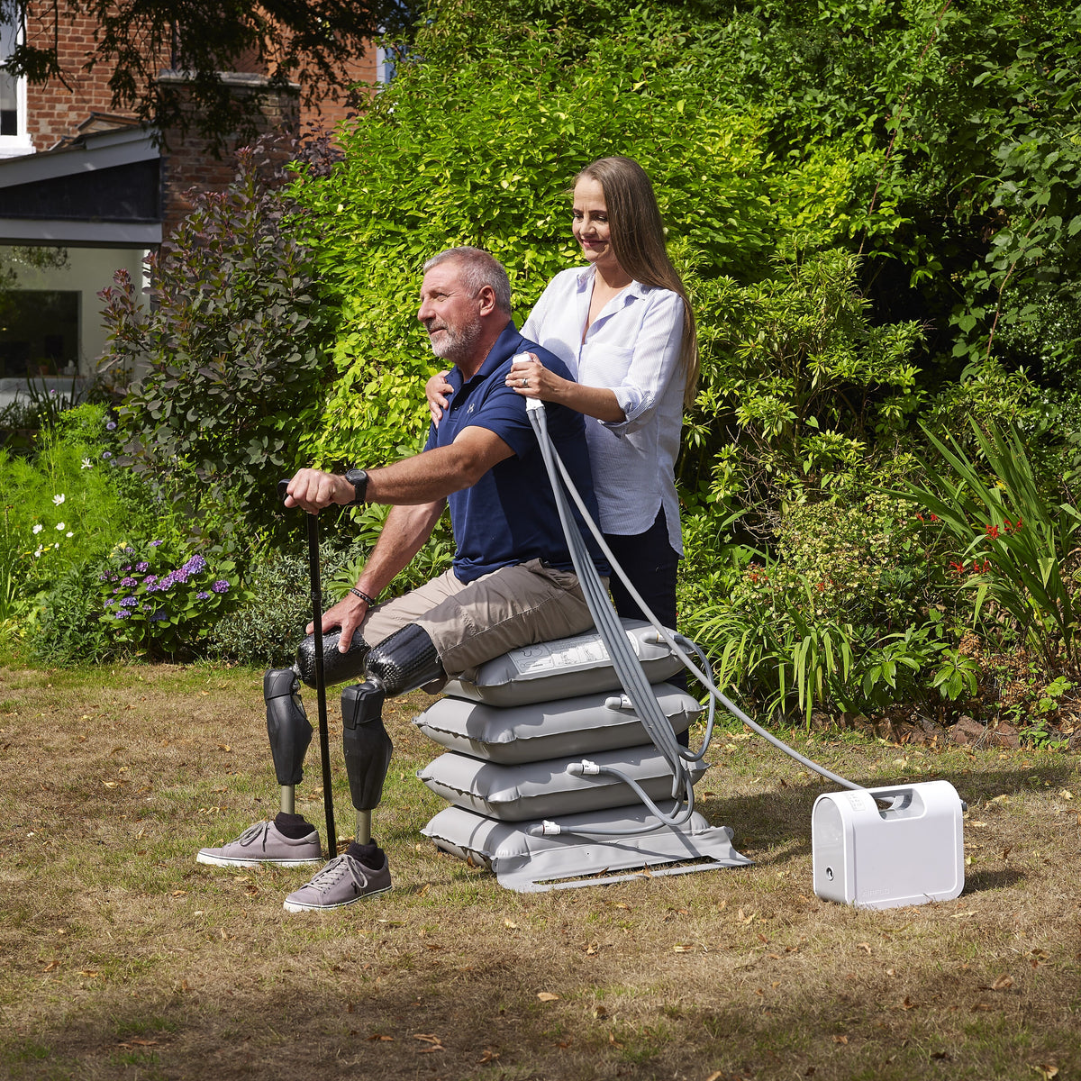 Mangar Elk Emergency Lifting Cushion cushion being compressed by a hand to show the level of support.
