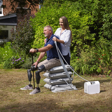 Mangar Elk Emergency Lifting Cushion cushion being compressed by a hand to show the level of support.