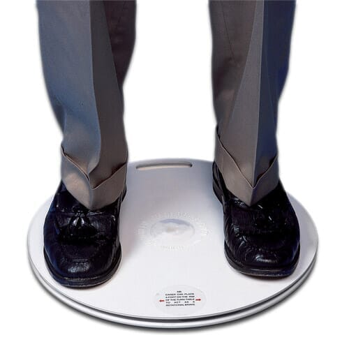 Full view of Medidisc Transfer Turntable mobile hoist on a plain background, showing the wheeled base, upright mast and sling attachment.