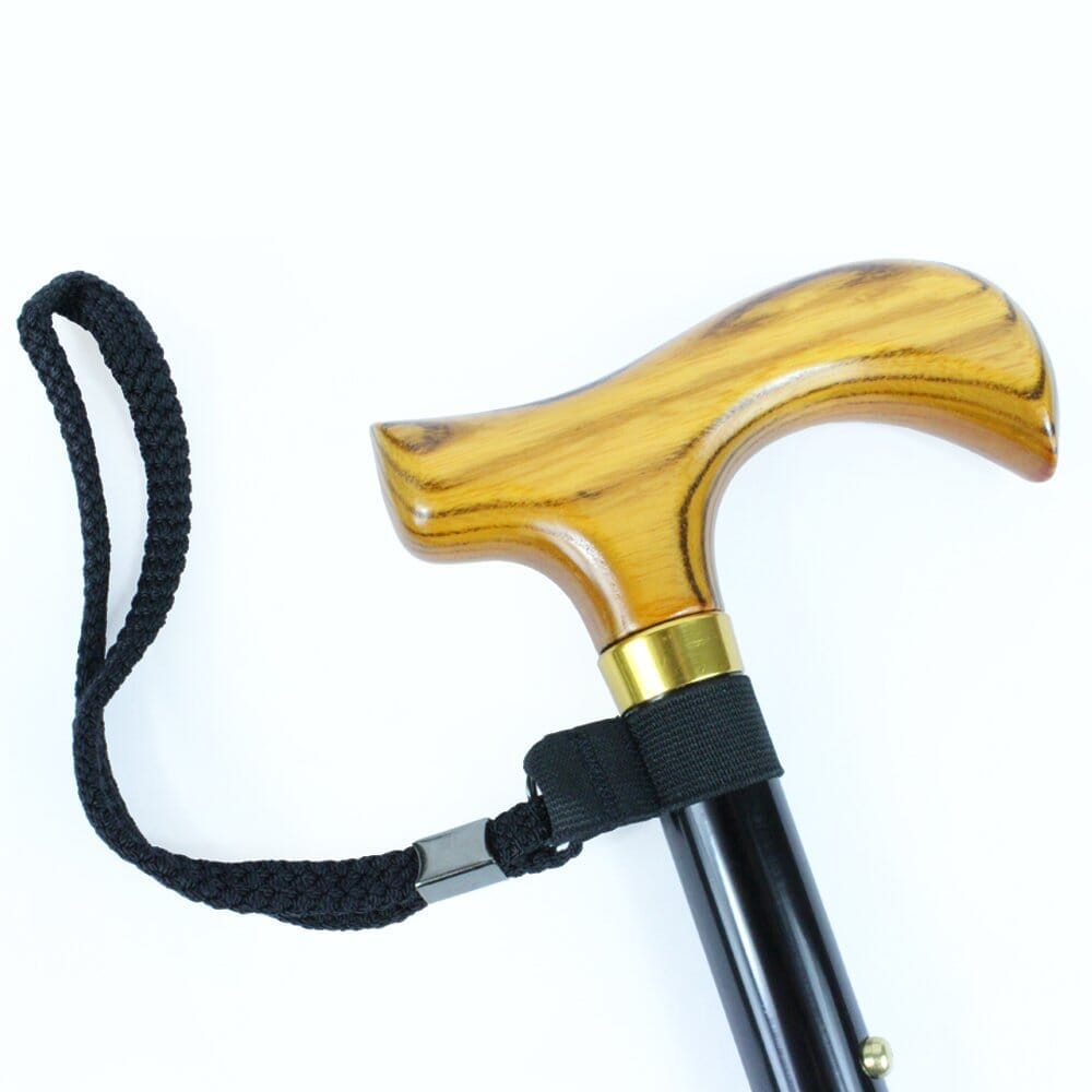 Close-up of the handle on Morris Mini Folding Walking Stick walking stick, highlighting the ergonomic grip.