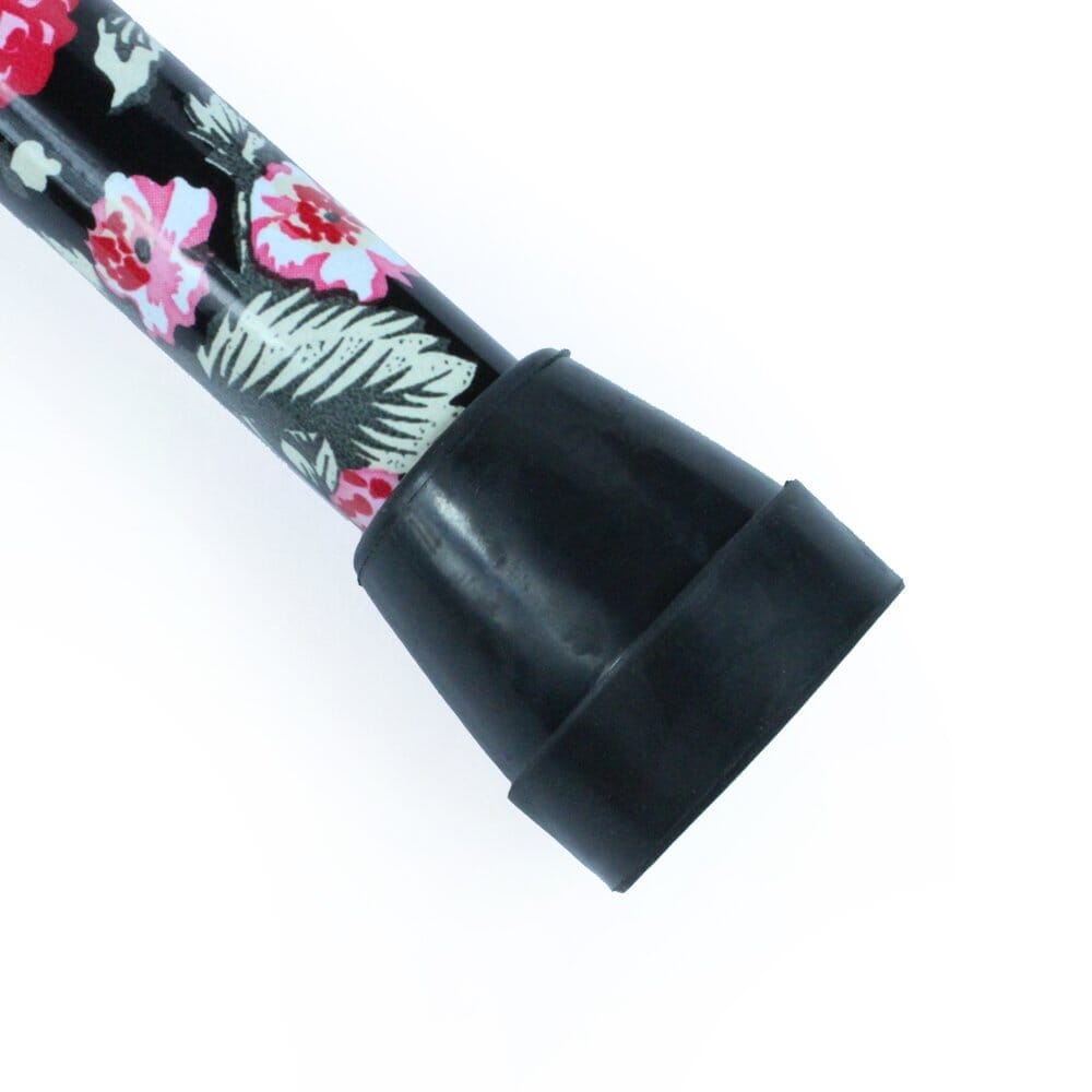 Morris Mini Folding Walking Stick walking stick in use by a person, demonstrating balance and support.