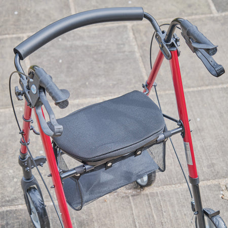 NRS 4 Wheel Lightweight Rollator rollator folded from the front, demonstrating its slim, space-saving design.