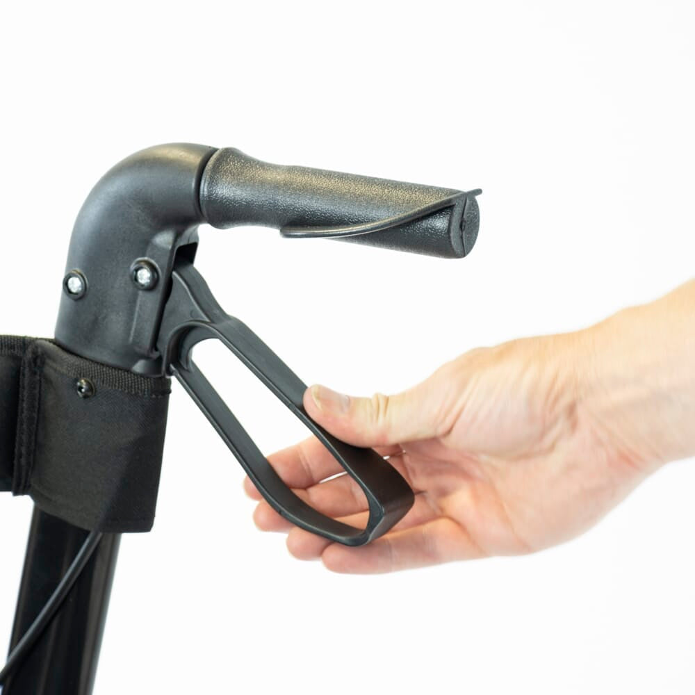 Close-up of the brake lever on NRS 4 Wheel Triple Fold Aluminium Rollator rollator being released, showing safety catch.