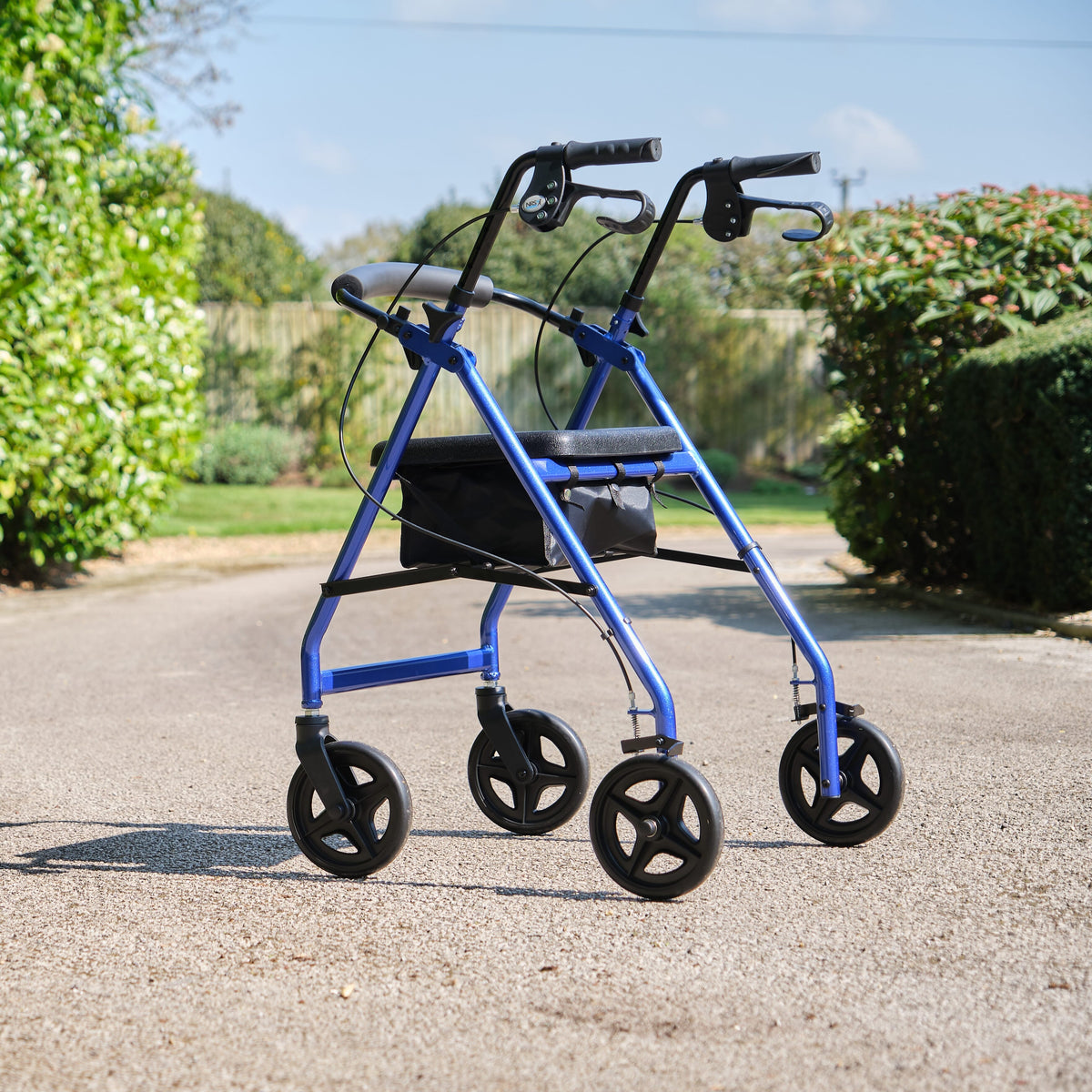 Fully folded NRS A-Series Lightweight 4 Wheel Rollator rollator lying flat, showing the triple-fold mechanism and compact size.