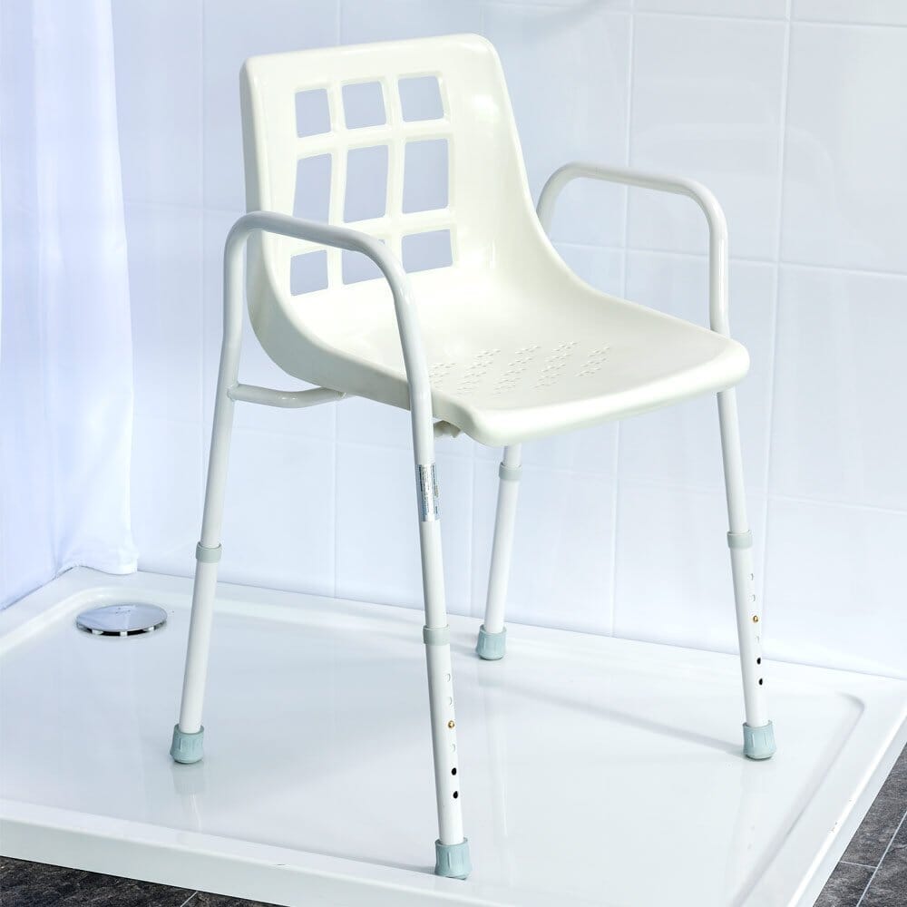 Angled view of NRS Adjustable Economy Value Shower Chair with moulded seat, supportive backrest and height-adjustable legs on a plain background.