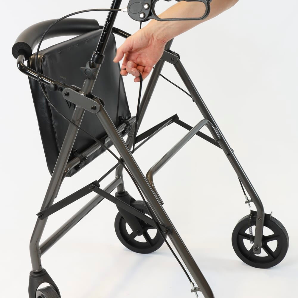 Close-up of the brake mechanism on NRS Bariatric 4 Wheel Aluminium Rollator rollator's wheel with spring and cable detail.