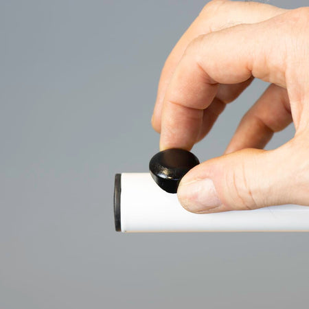 Close-up of a push button or knob on NRS Beech Overbed Overchair Table's frame used for adjusting height or tilt.