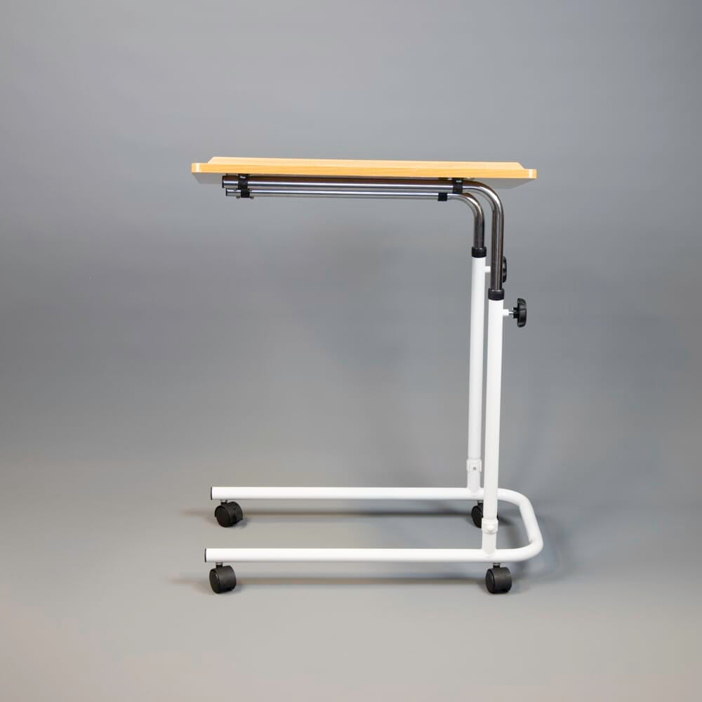 Side view of NRS Beech Overbed Overchair Table with the table top level at its lowest height.