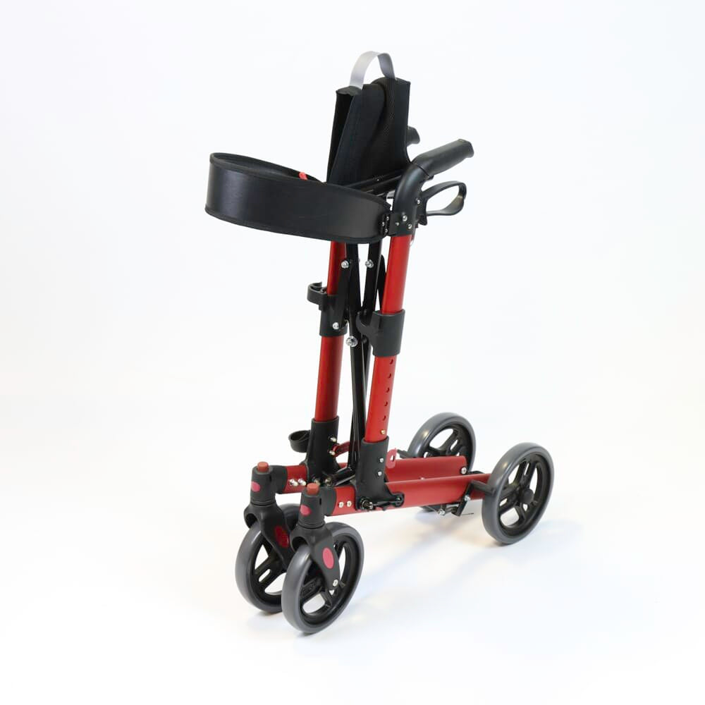 Fully folded NRS Compact Easy Plus Rollator rollator lying flat, showing the triple-fold mechanism and compact size.