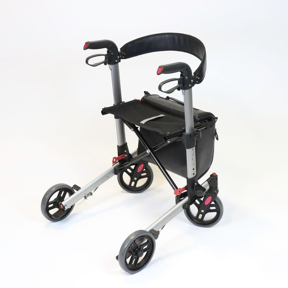 Close-up of the brake mechanism on NRS Compact Easy Plus Rollator rollator's wheel with spring and cable detail.