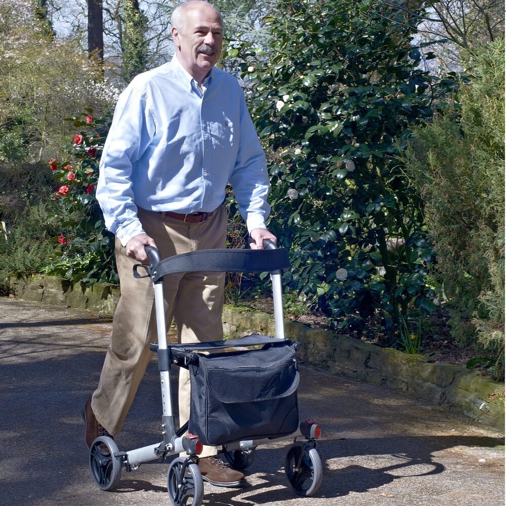 NRS Compact Easy Rollator rollator folded from the front, demonstrating its slim, space-saving design.