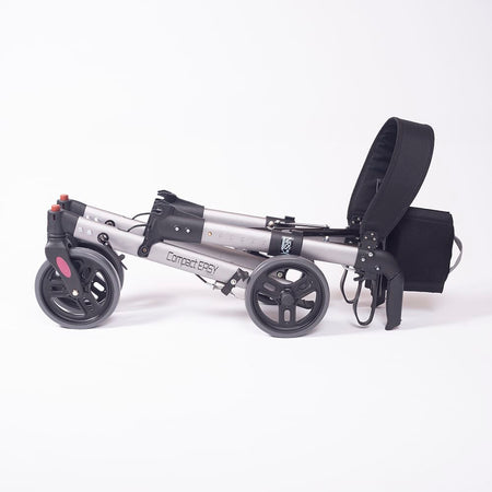 Close-up of a hand squeezing the brake lever on NRS Compact Easy Rollator rollator's handle.