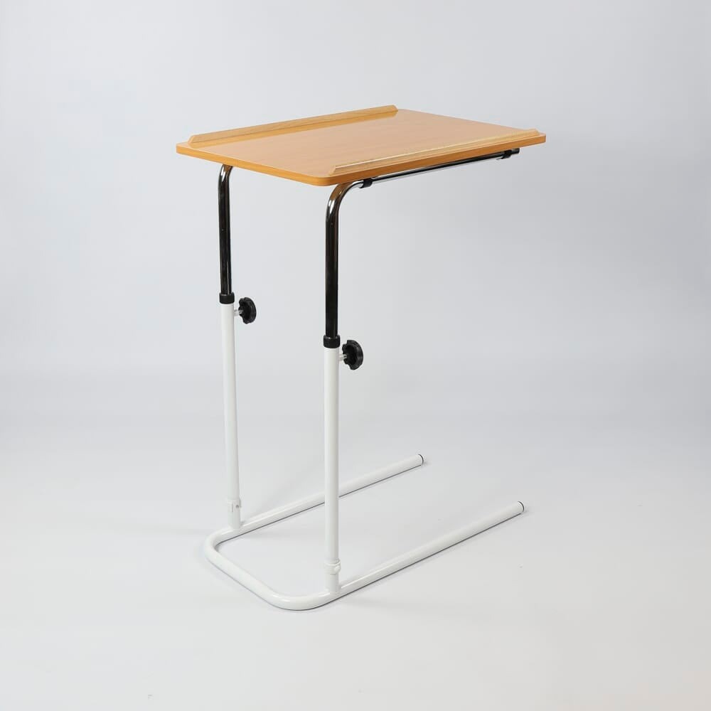 Close-up of the castor wheels on NRS Divan Overbed Table, showing the smooth-rolling casters and brake mechanism.