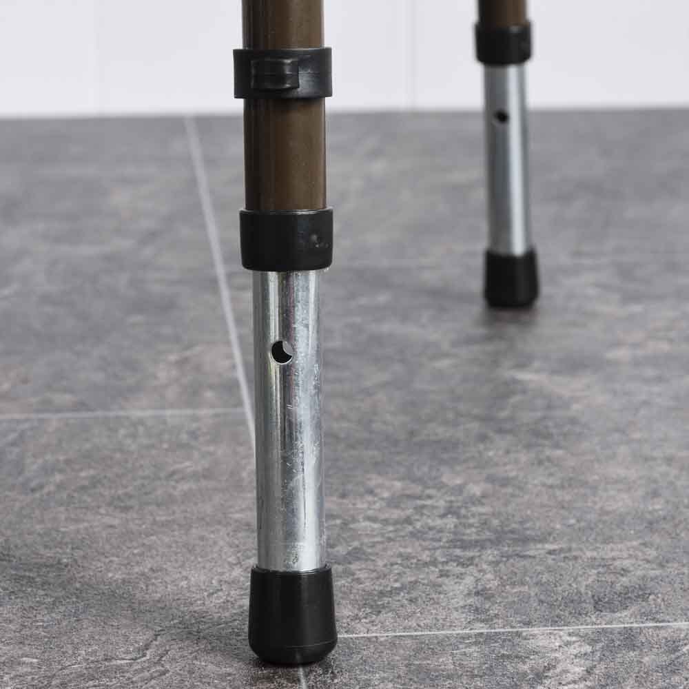 NRS Dovedale Adjustable Commode in use in a home setting, with lid open to illustrate accessibility and convenience.