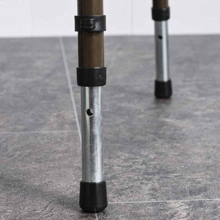 NRS Dovedale Adjustable Commode in use in a home setting, with lid open to illustrate accessibility and convenience.