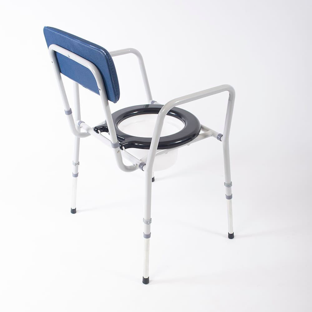 Person emptying or cleaning the commode pan of NRS Dovedale Adjustable Commode into a standard toilet.