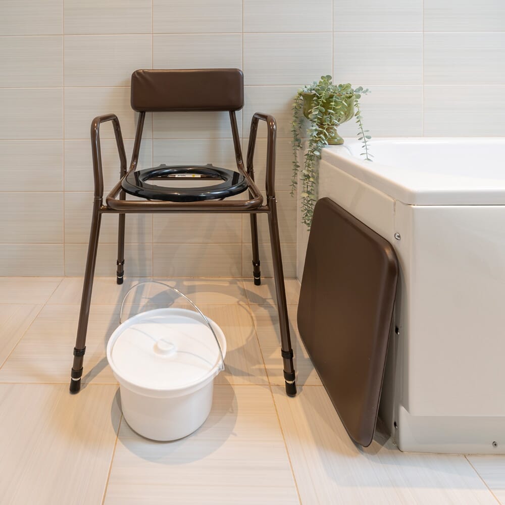 NRS Dovedale Adjustable Commode with Detachable Arms with lid closed, highlighting the padded seat and discreet design.