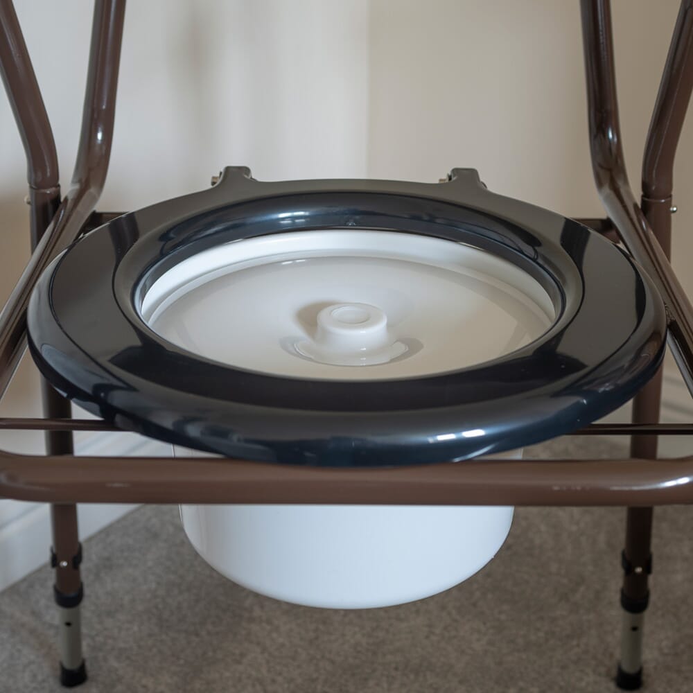 Close-up of the height-adjustable legs or non-slip feet on NRS Dovedale Adjustable Commode with Detachable Arms.