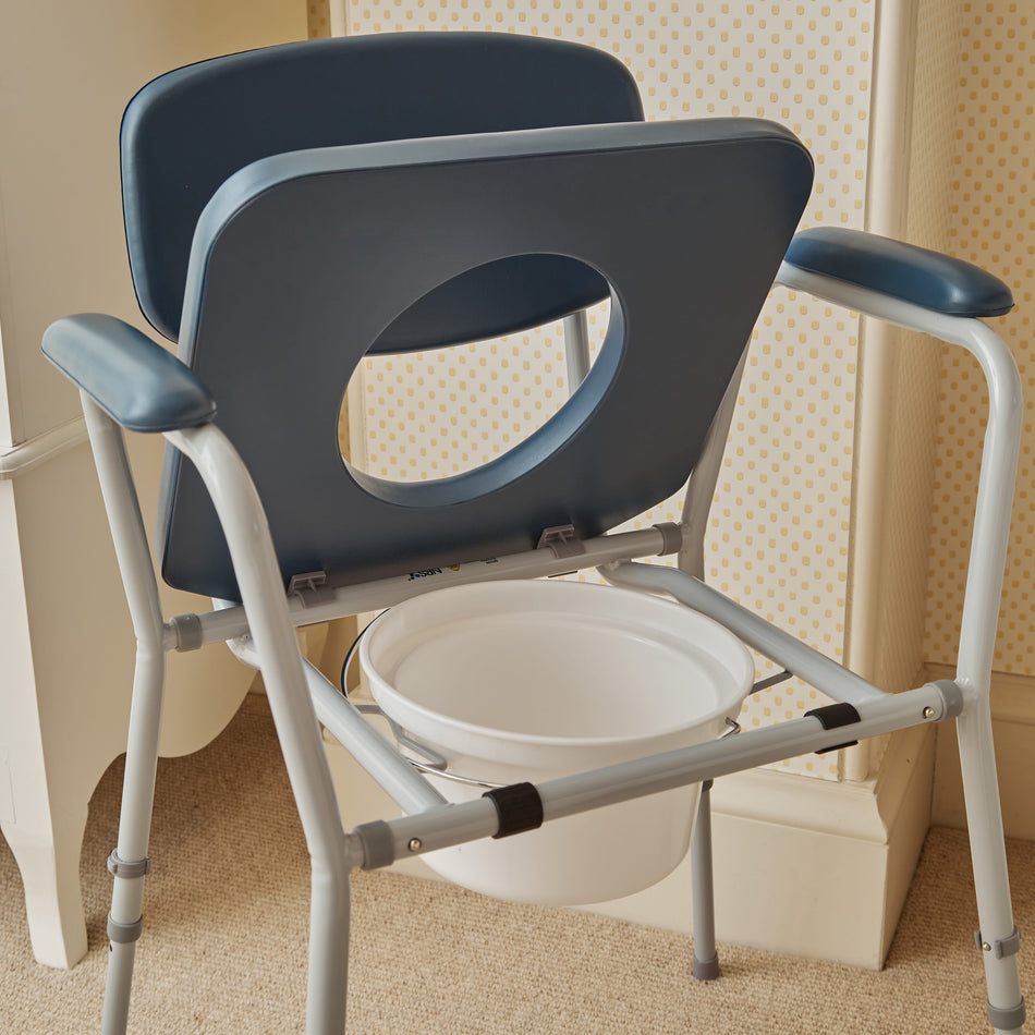 NRS Dovedale Comfort Commode with lid closed, highlighting the padded seat and discreet design.