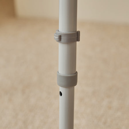 NRS Dovedale Comfort Commode positioned in a home environment such as a bedroom or bathroom, demonstrating its discreet appearance.